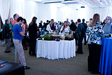 Holiday Party guests mingle and enjoy the food.