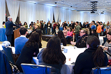 Dean LaFerla welcomes guests at holiday party