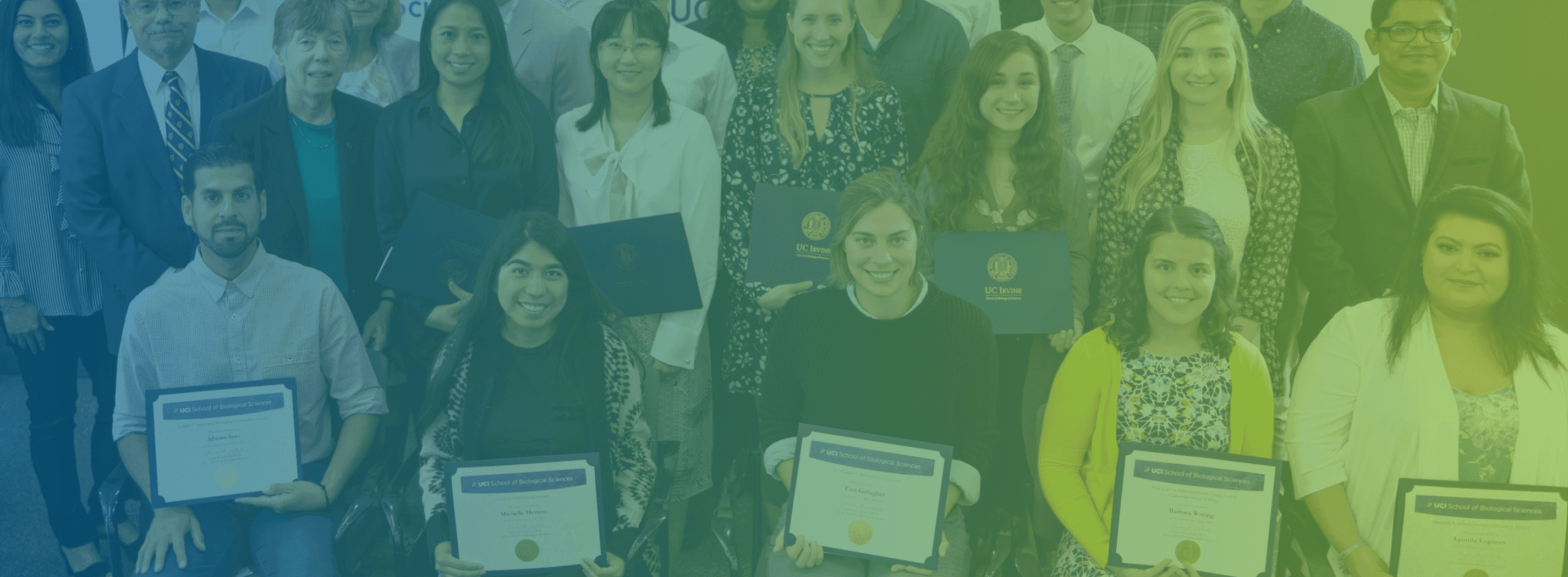 Awardees taking a group picture faded in blue and yellow