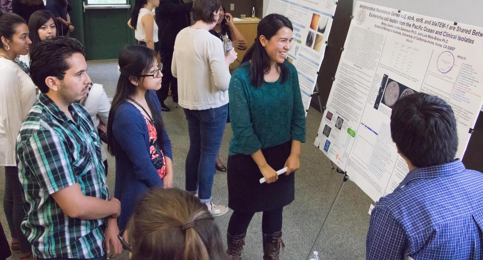 People reading a board at Minority Science Program