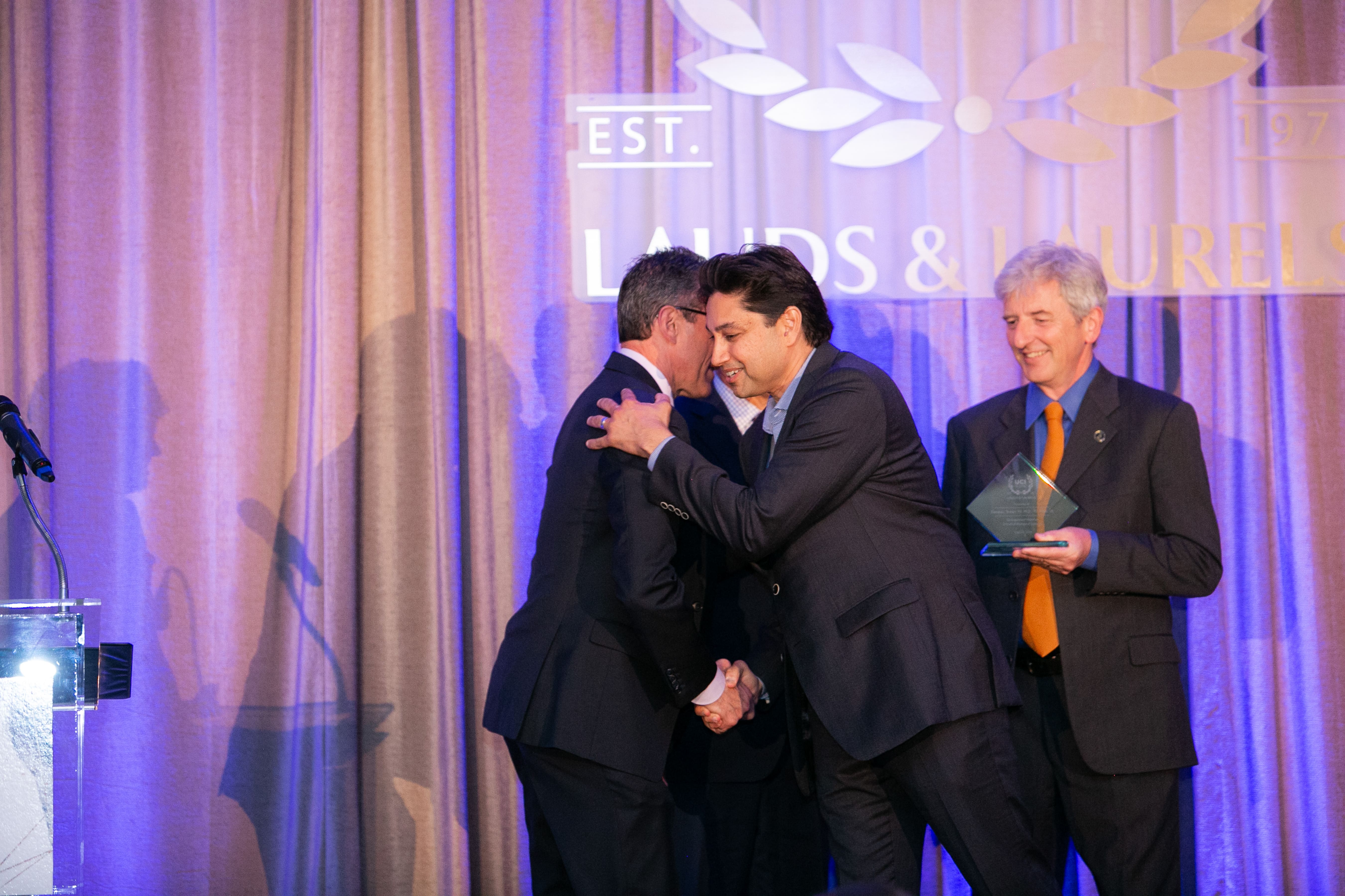 Dean Michael Stamos, Dean Eric Spangenberg, Professor Chris Hughes, and Devansu Tewari ’93, M.D. ’97, MBA ’14