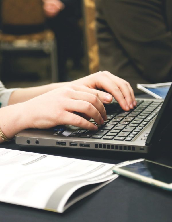 Woman typing on laptop Labeled for noncommercial reuse
