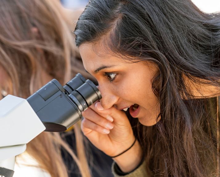 Student using a microscope