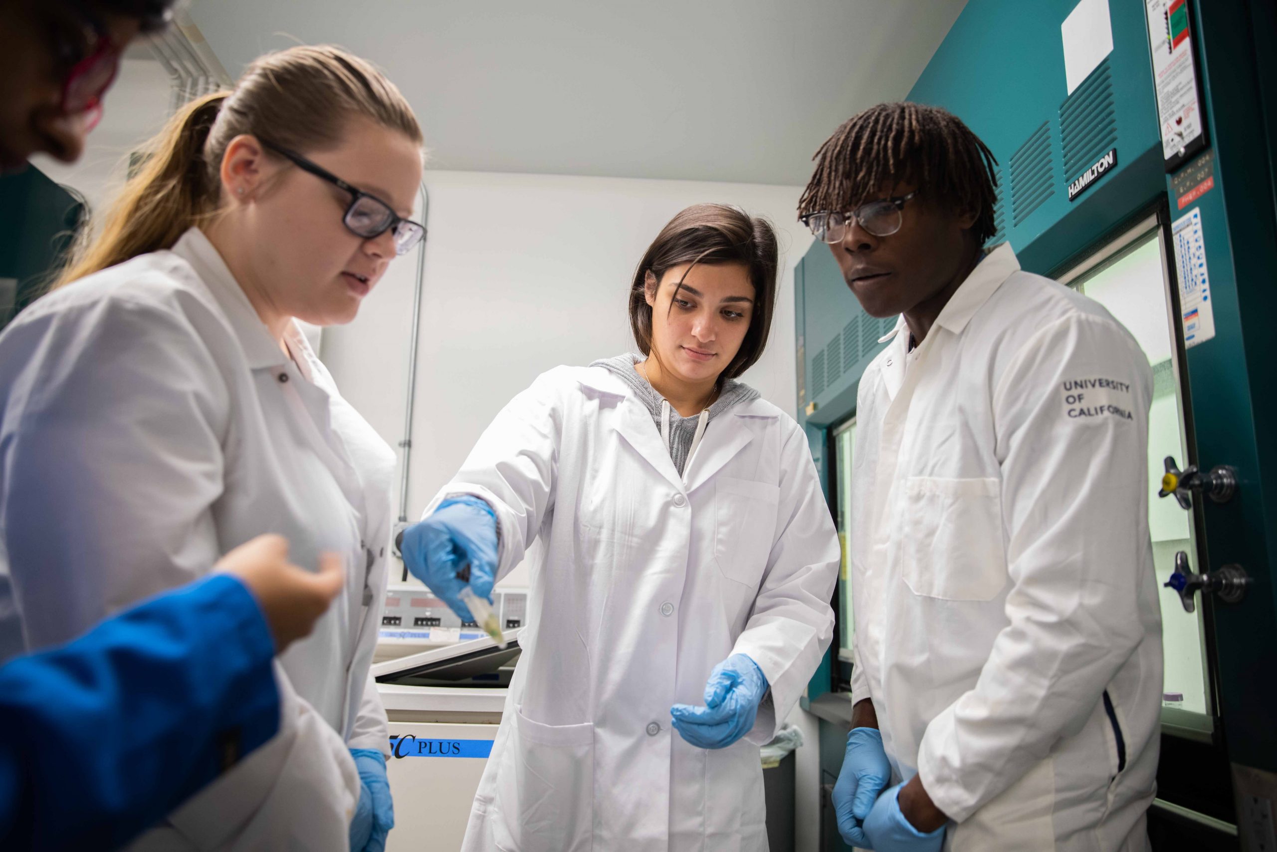 three researchers in a lab