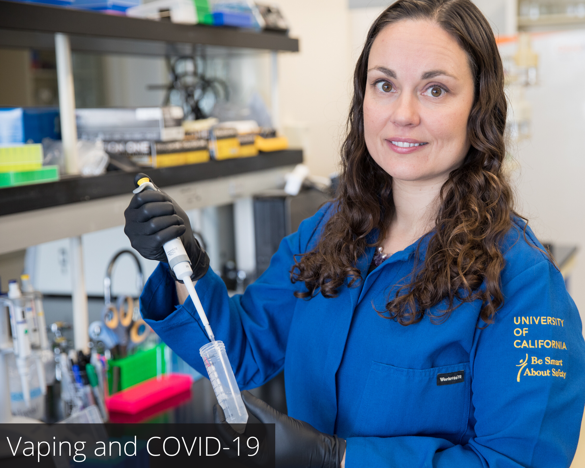 Christie Fowler V3 Christie Fowler, PhD. in a lab holding test tubes