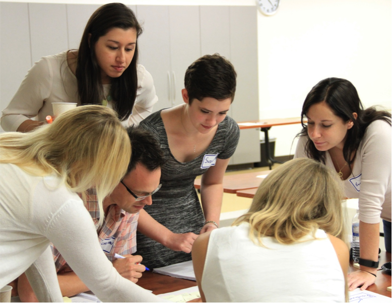 peer career professional development group discussing around a table