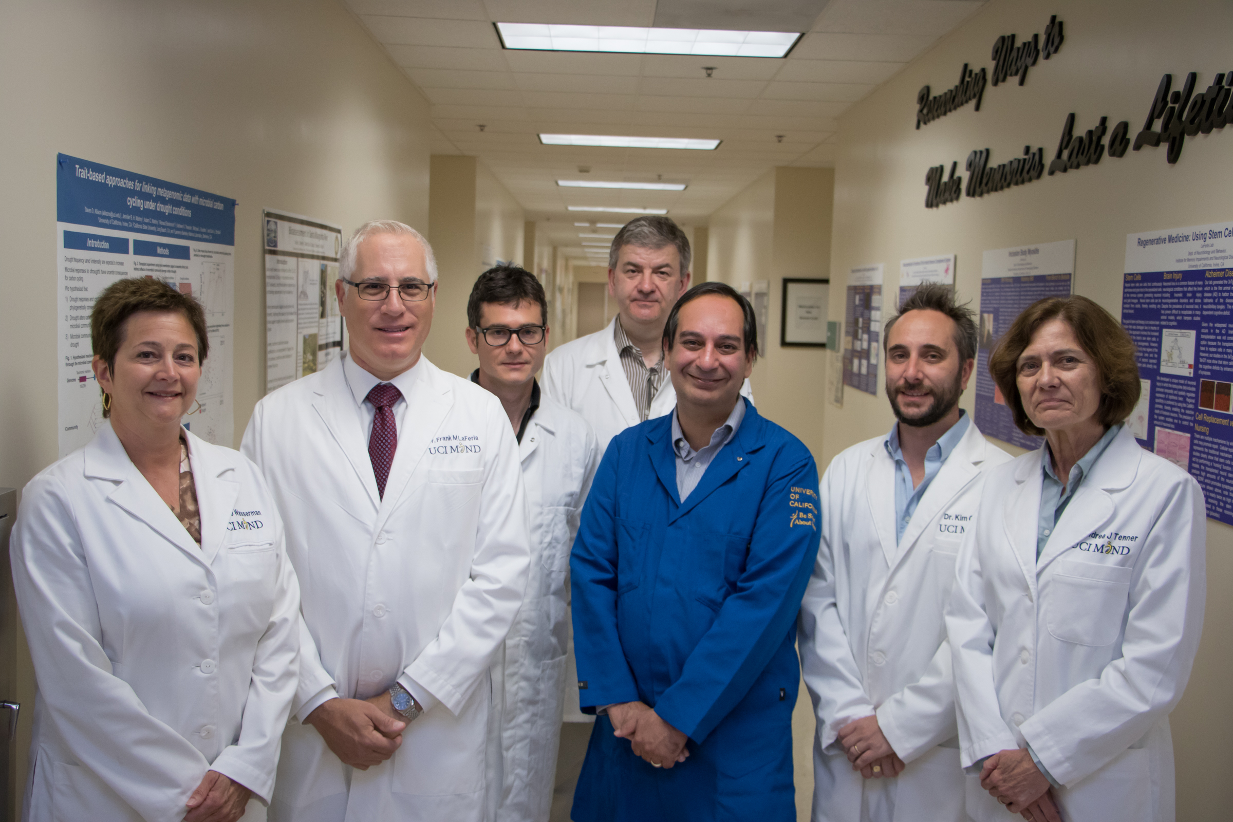 Group of scientists standing in a lab.