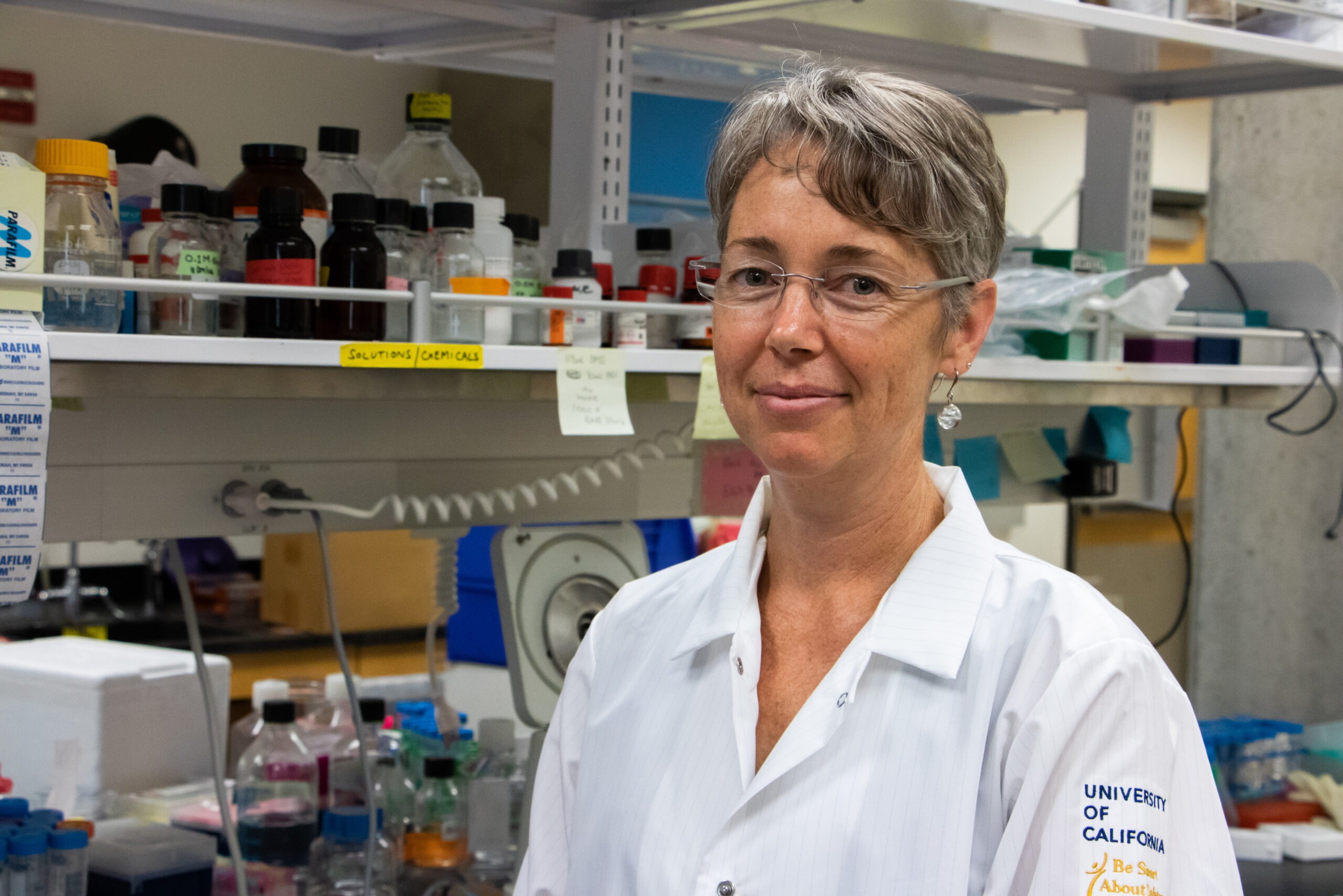 Aimee Edinger smiles in the lab