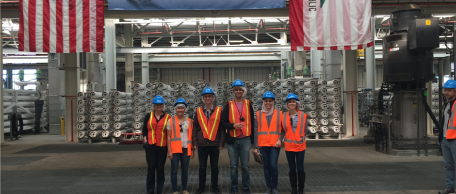 The Whiteson lab poses for a photo at a waste treatment plant.