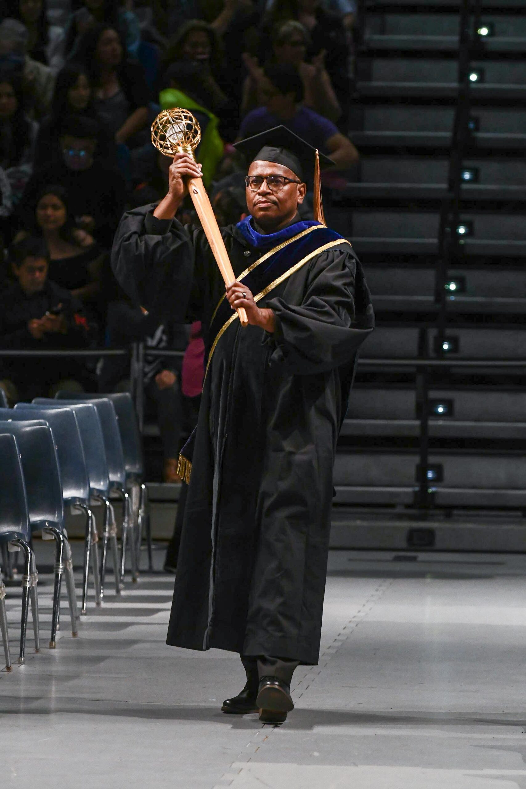 BioSci Alumnus Spotlight Roderick Seamster, MD, MPH, ‘82 BioSci Alumnus, Roderick Seamster, MD, MPH, ‘82 walking down to the graduation stage as the 2019 BioSci Mace Marshal