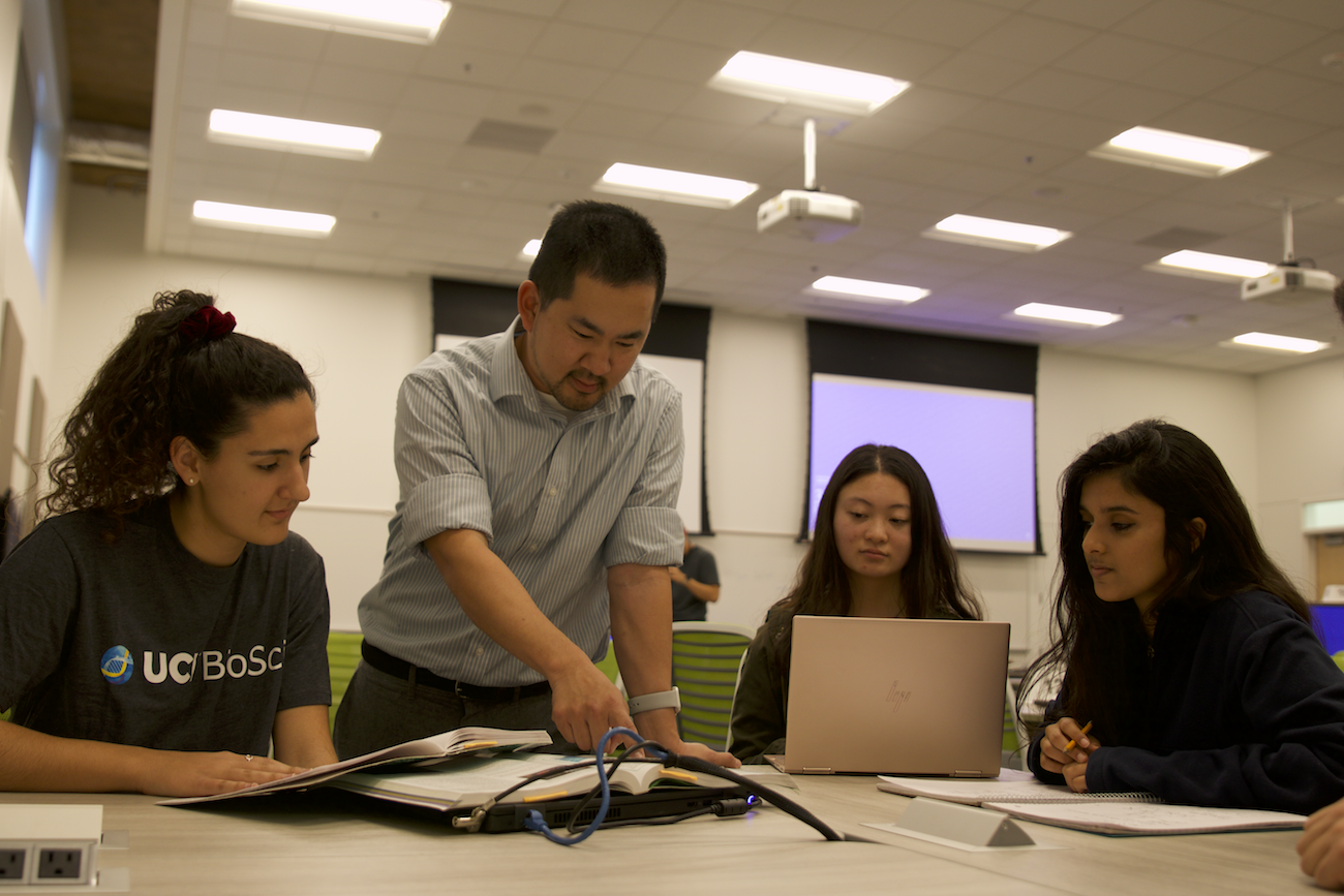 professor sato with students in a classroom