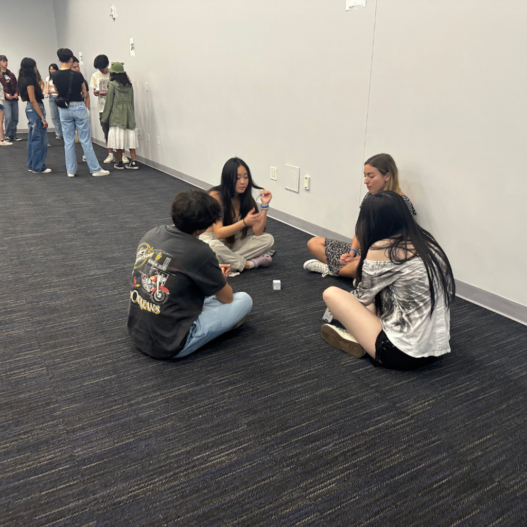 students sitting on floor